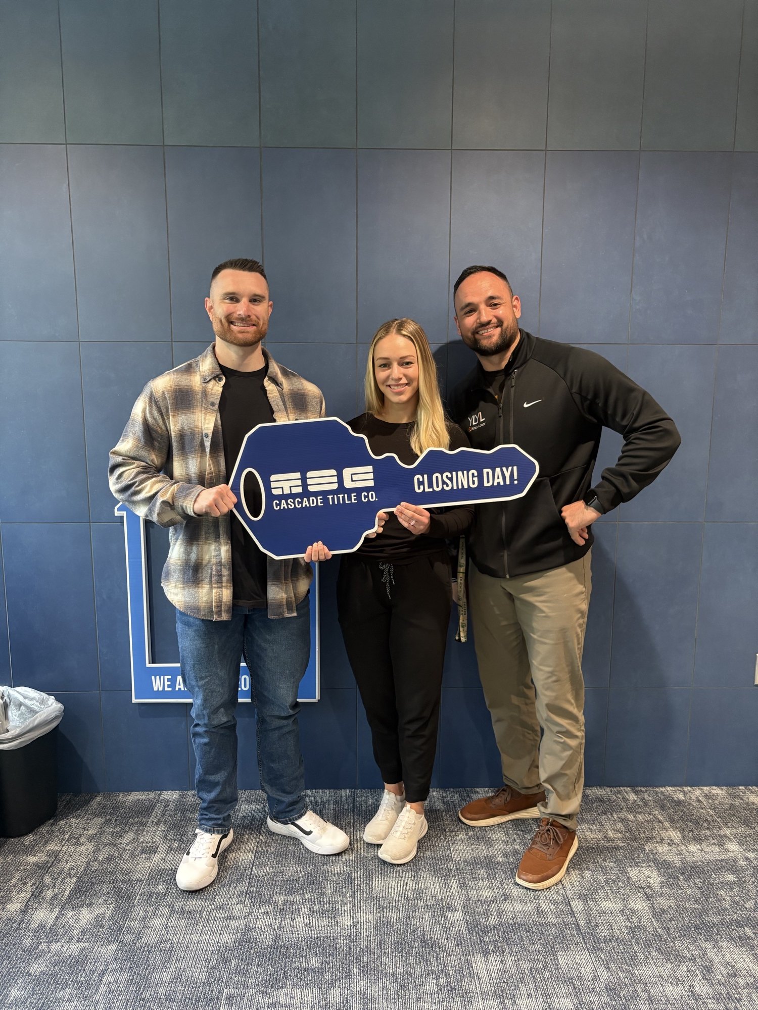 Brett Herring with clients on closing day at Cascade Title in Eugene, Oregon