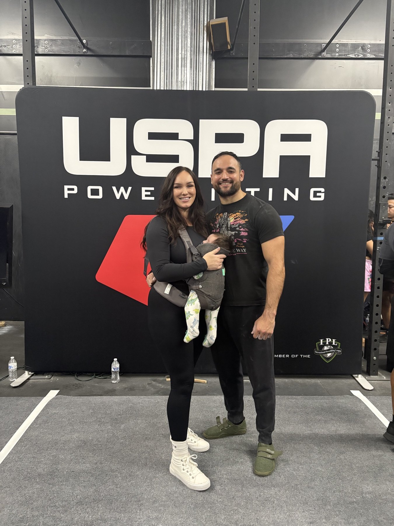 Brett Herring with his family at a USPA powerlifting meet